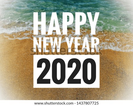 New Year Quote On Blurred Sandy Beach Background