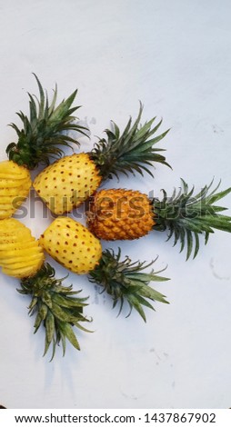 Sweet and delicious pineapple which is still intact and which has been peeled
