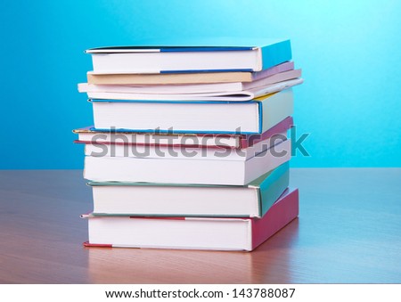 Big pile of books, on a blue background