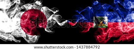 Japan vs Haiti, Haitian smoky mystic flags placed side by side. Thick colored silky smokes combination of Haiti, Haitian and Japanese flag
