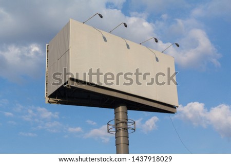 Empty billboard and building on the sky background