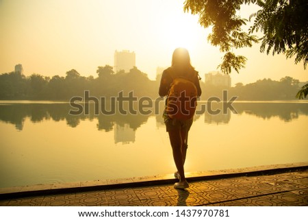 Female photographer.Female photographer photographed in the morning. Travel