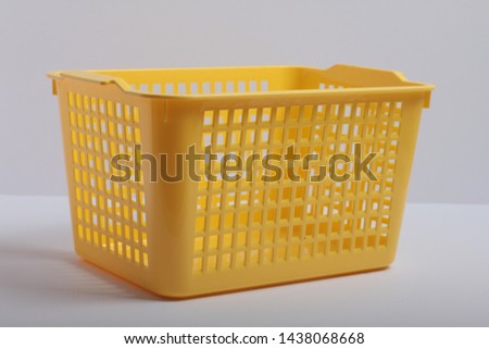 yellow plastic container on white background