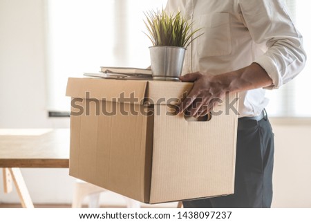Downsize business. Employee moving off from office after sacked from company. Royalty-Free Stock Photo #1438097237