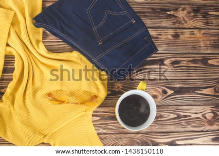 Top view shot of autumn background. Fall woman`s clothes flat lay picture. Woman wardrobe.