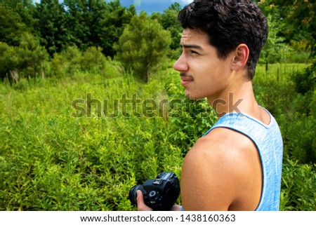 Boy with Camera in the Wild
