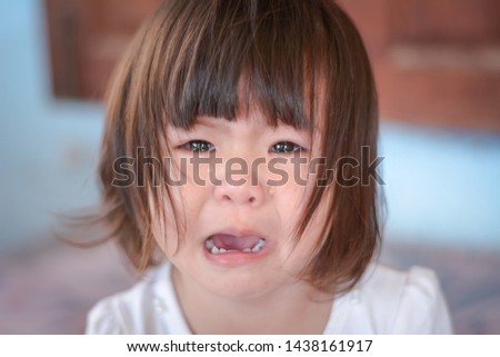 Close-up pictures of girls brown hair crying