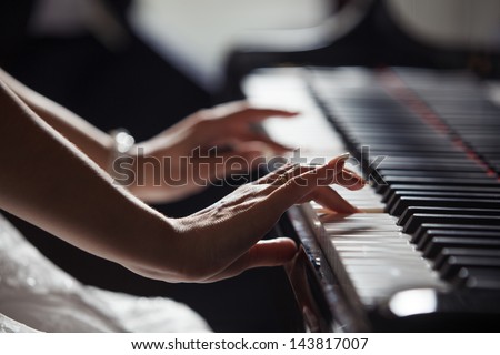 Playing piano Royalty-Free Stock Photo #143817007