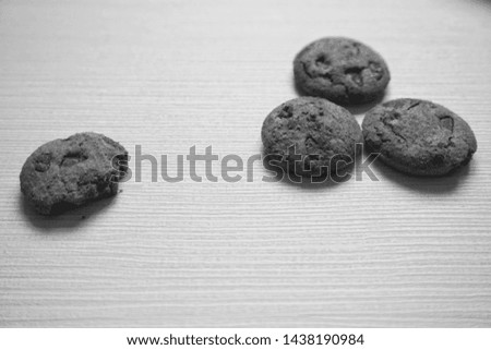 Closeup chocolate cookies on the table. Black and white images. 