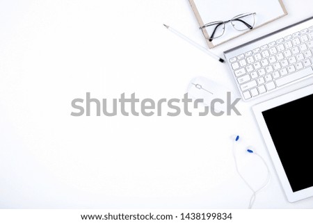 Tablet, keyboard computer with glasses, mouse and pencil on white background