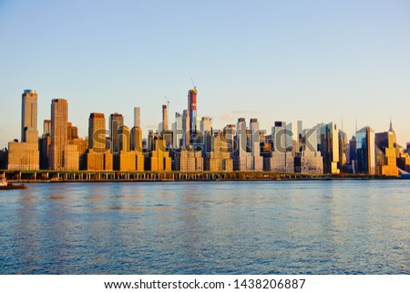 Panoramic view of beautiful skyline of upper Manhattan at sunset viewed across Hudson River from west New York New Jersey usa
