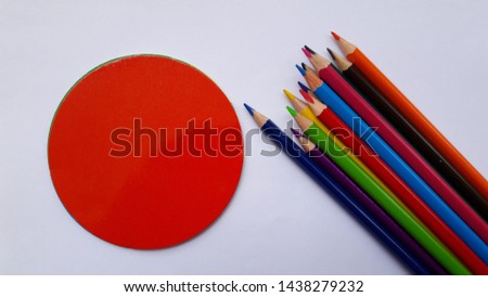 color pencils with color shapes isolated on white background