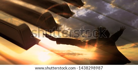 Piano music concept.Piano keys abstract background and man with open arms. Relax music for travel road.