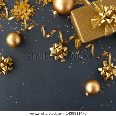 Christmas background .  new year golden decorations top view frame on gray  backdrop. copy space. Trend color 2022 Poppy Seed.