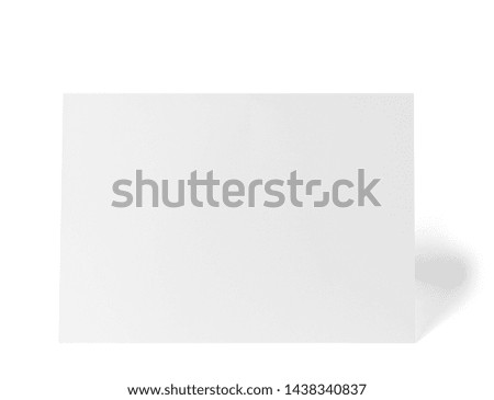 close up of a  blank folded leaflet or a desktop calendar white paper on white background 