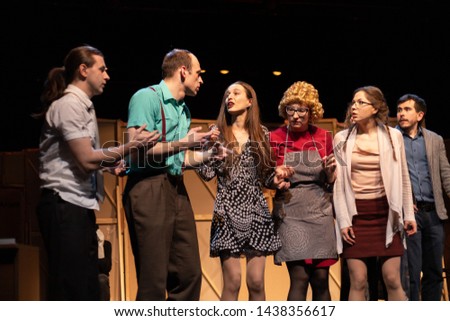 Actors and actresses play comedy, a show performance on the theater stage Royalty-Free Stock Photo #1438356617