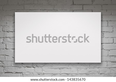 Image of blank billboard over white brick wall