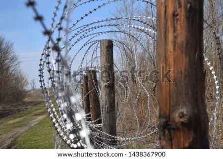 barbed wire fence on the border