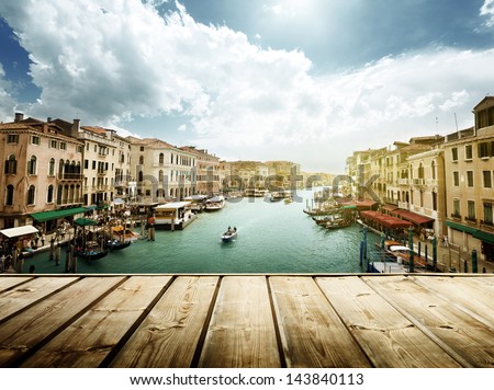 Venice, Italy and wooden surface Royalty-Free Stock Photo #143840113