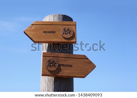 tourist wooden signpost with a tourist sign showing the direction to the observation deck