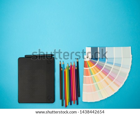flat lay, blue background, graphic design concept 
