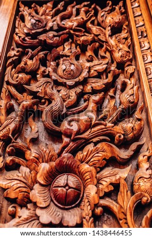 Traditional Thai style wood carving ,(Wat Maha Wanaram) in Ubon ratchathani,Thailand any kind of art decorated in Buddhist church etc. created with money donated by people,
