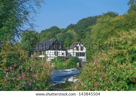 historic House at Wupper River called Wipperkotten near Solingen,Bergisch Land,Germany Royalty-Free Stock Photo #143845504