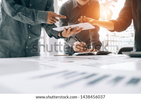 Business people analyzing investment graph meeting brainstorming and discussing plan in meeting room, investment concept Royalty-Free Stock Photo #1438456037