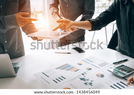 Business people analyzing investment graph meeting brainstorming and discussing plan in meeting room, investment concept Royalty-Free Stock Photo #1438456049