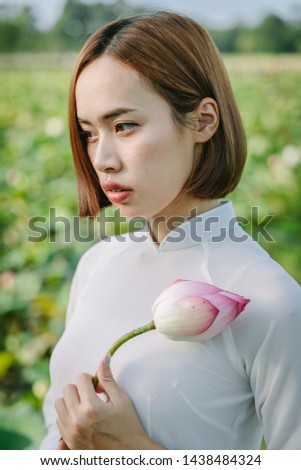 Beautiful Vietnamese girl Vietnamese lifestyle, lotus flower fields