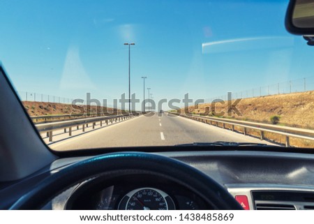 View from the car cab, driving on the highway