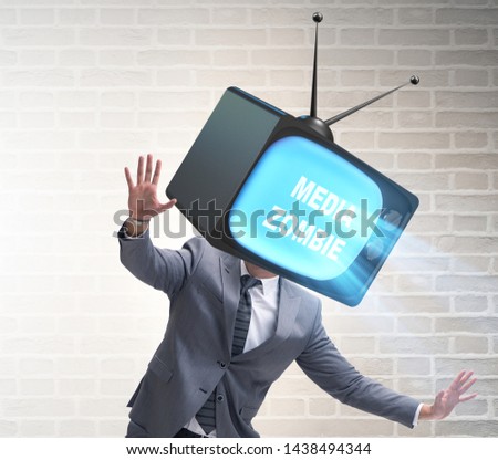Media zombie concept with man and tv set instead of head