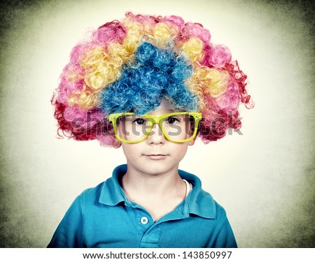 Little boy wearing clown wig in vintage technique