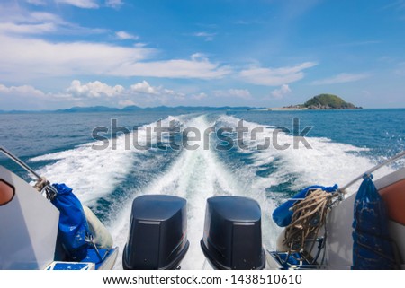 A speedboat passing by at high speed on the sea