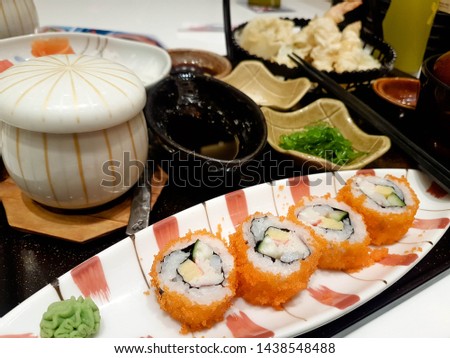 Set of sushi and maki on Black wood tray table. Top view with copy space