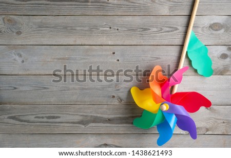 Set of toys for newborn on wooden background. top view