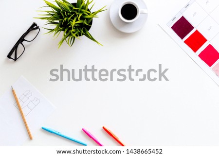 Designer work space with pallet, glasses, plant and coffee on white background top view mockup