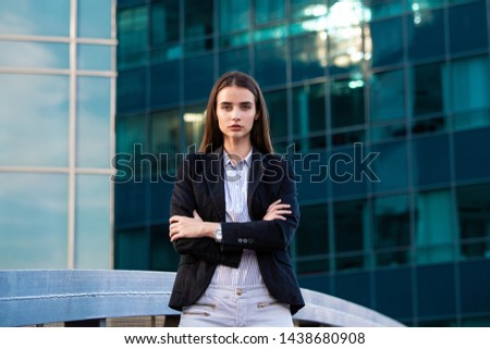 Portrait of a successful business woman. Beautiful young female executive in an urban setting