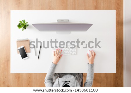 Woman using computer. Top view