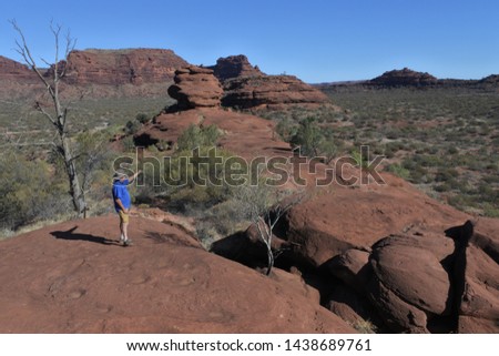 Australian active senior adult man hiking in Finke Gorge National Park in the Northern Territory of Australia. Real people. Copy space Royalty-Free Stock Photo #1438689761