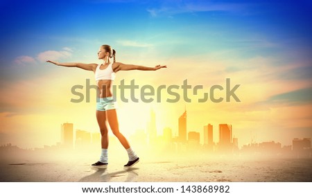 Image of young attractive sport woman exercising