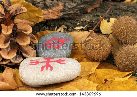 Fortune telling  with symbols on stones close up