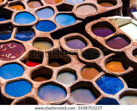 Fez is also famous for its old leather Tanneries. Old tanks of the Fez's tanneries with color paint for leather, Morocco, Africa. Artistic picture. Beauty world