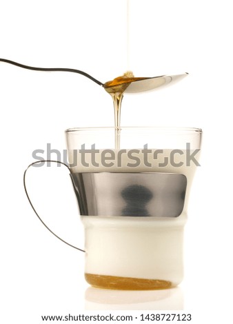 Hot Milk with Honey on white Background