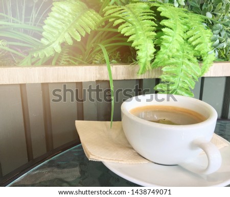 Hot coffee in a white cup on the table,Refreshing in the morning ,concept.