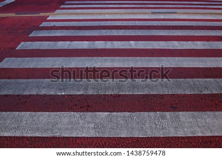 Pedestrian crossing, white and red colors for background