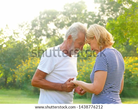 Portrait Happy Elderly couple Living in retirement with happiness in the garden.