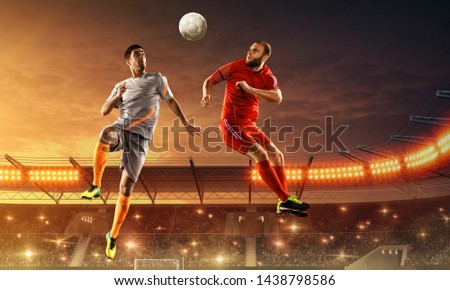 Soccer players fight for a ball. Aerial play