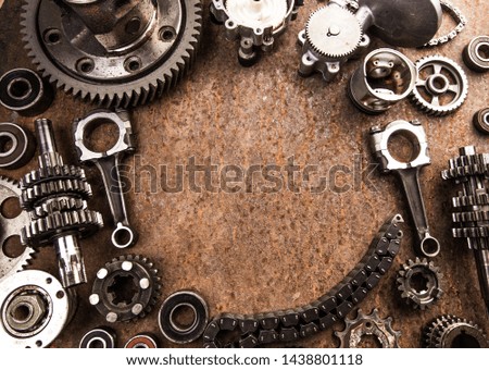 Various car parts and accessories, on metal  background
