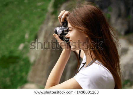woman photographing nature mountains beauty